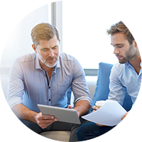 Man in orange walking in office