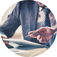 Business man and woman looking over tablet computer