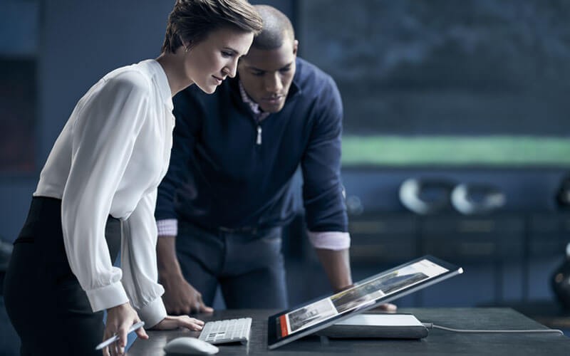 Woman working on Surface Studio