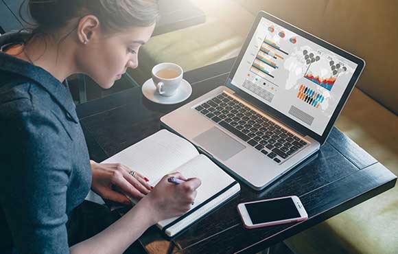 Smartly dressed female taking notes