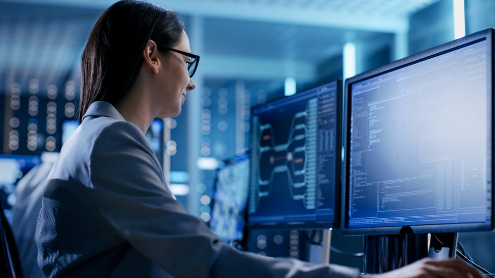 Woman assessing data on a computer