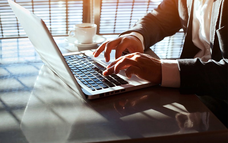Secure your business Man working on a laptop
