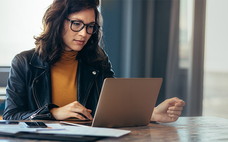 Analyse data from across all your communication touch points Woman working in an office