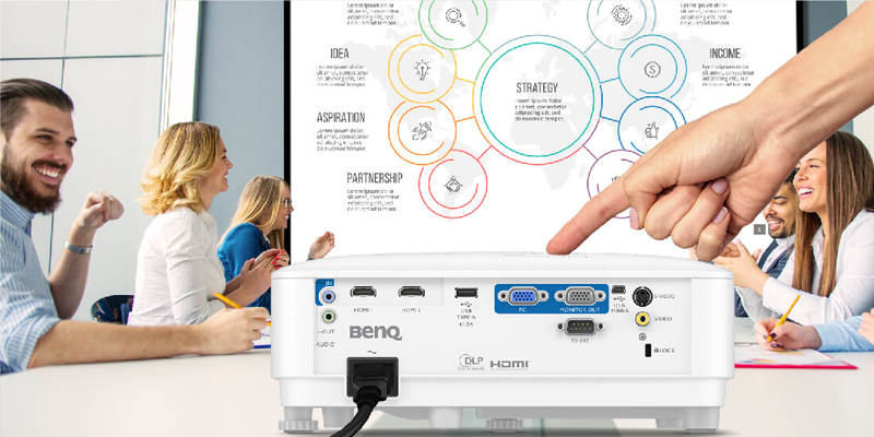 Man setting up a projector for a presentation