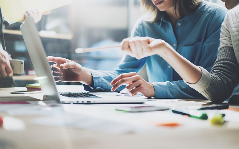 Working at desk with laptop