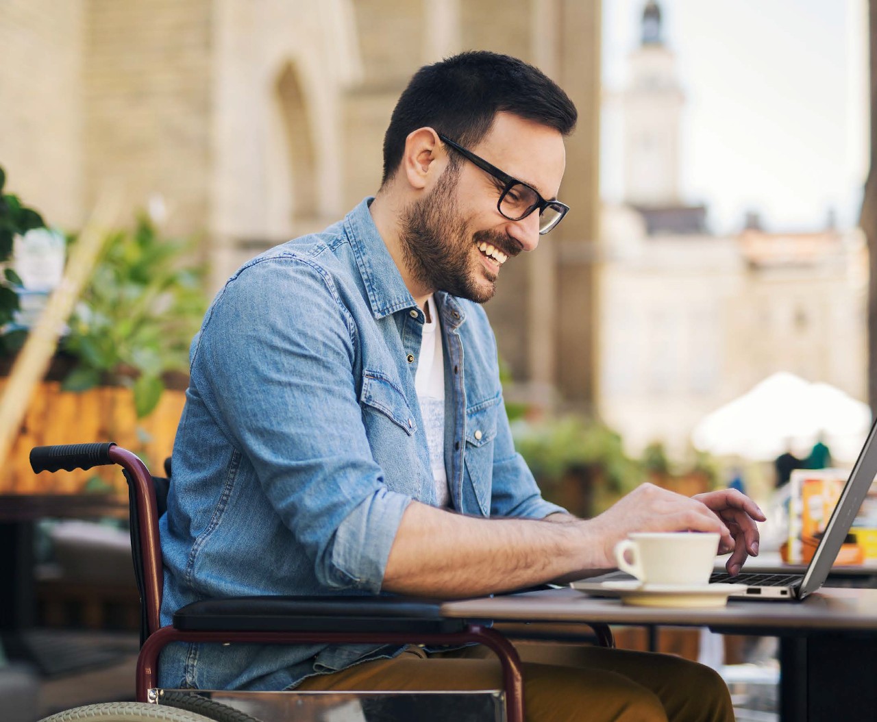 remote worker on laptop at cafe