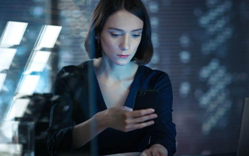 Woman looking at mobile device