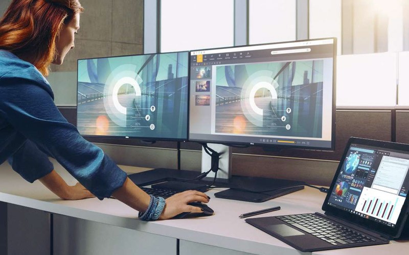 Woman using Dell monitors