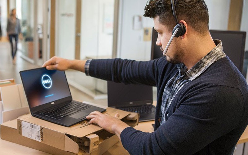 Dell IT technician setting up Dell device for office