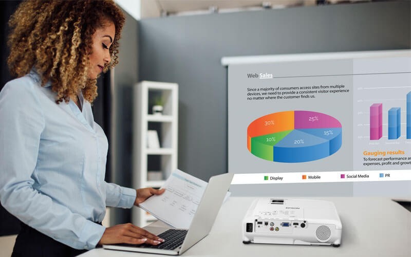 Epson projectors enhance communication and inspire collaboration Woman working at standing table with Epson projector