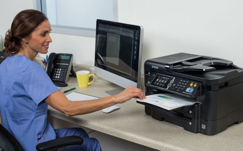 Epson print solutions for every industry Healthcare woman printing using Epson printer