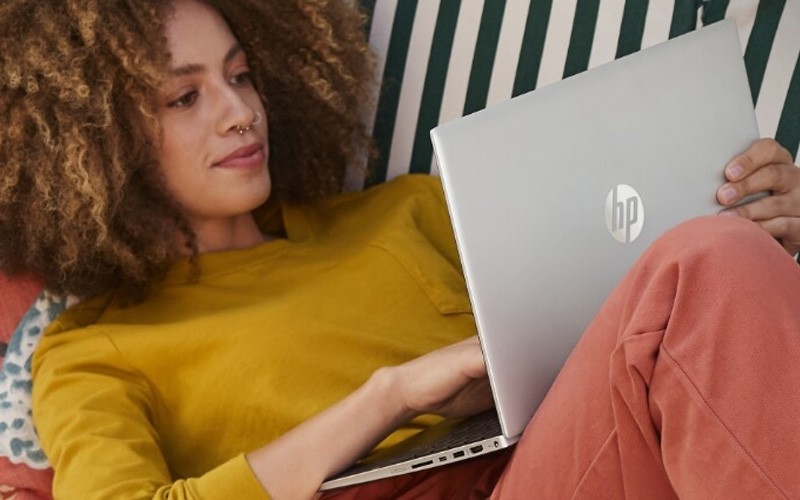 Woman working confidently on a HP device