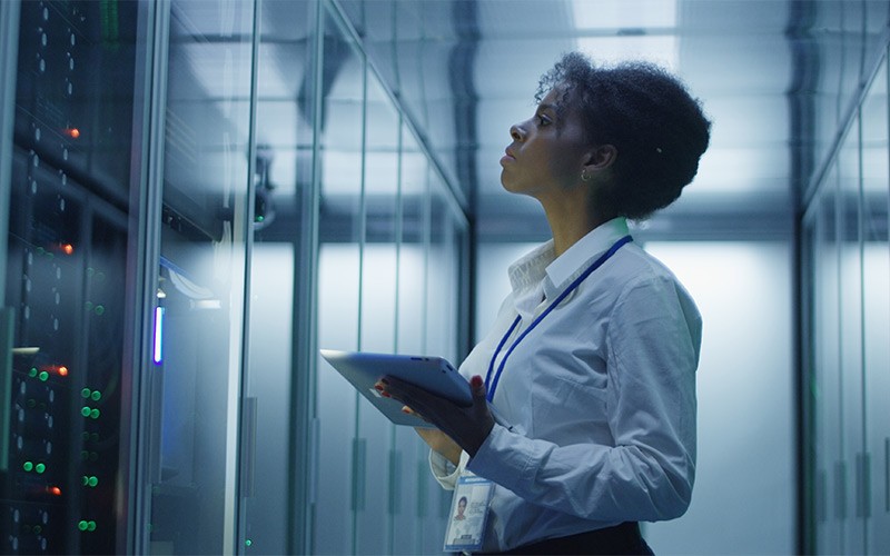 Woman standing in Server room
