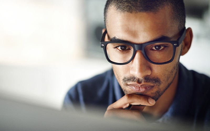 Intel Solid State Drive storage Smiling man looking at desktop monitor