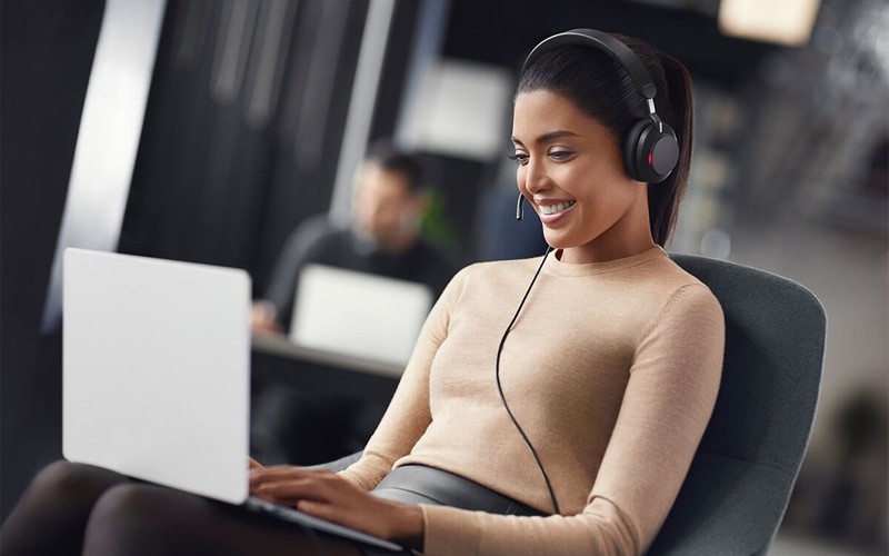 Quiet delivered to your desk Woman in meeting using Jabra Evolve