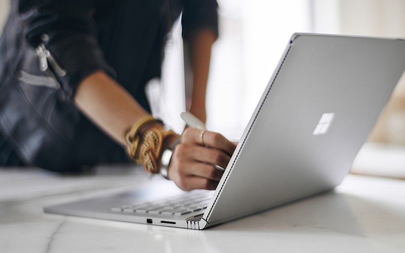 Woman using Microsoft Surface