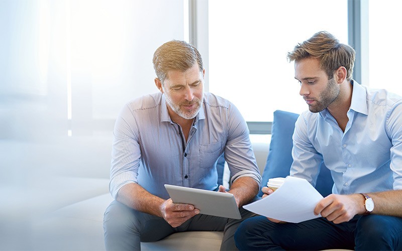 Sophos Central unified console and cloud platform Two businessmen talking