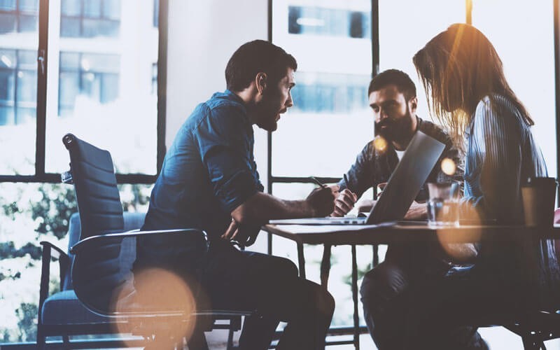 Synchronise your security management Coworkers working together